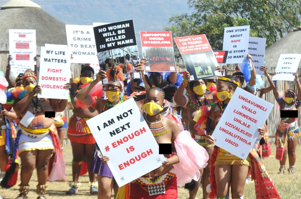 Maidens carrying plug cards written different massages against women abuse and killings instead of reeds during Reed Dance Festival held at Enyokeni Royal Palace in Nongoma north of KZN. Photo by Jabulani Langa