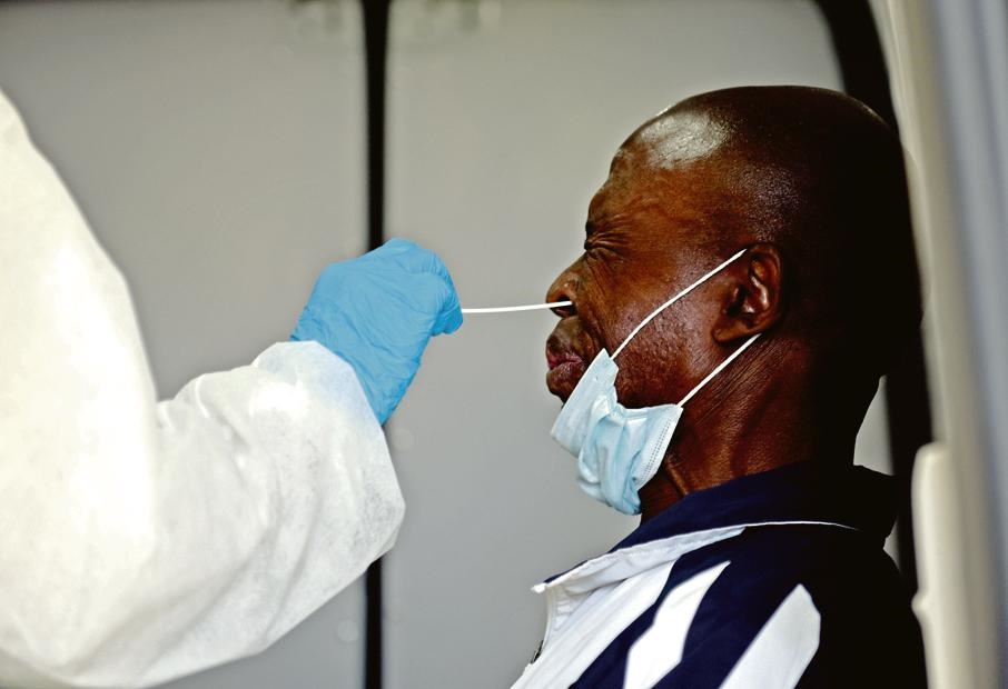 A man is swabbed during the Covid-19 scanning and testing process that took place in Diepsloot this week. Gauteng Premier David Makhura and health MEC Bandile Masuku visited the site during the proceedings. Picture: Tebogo Letsie/City Press