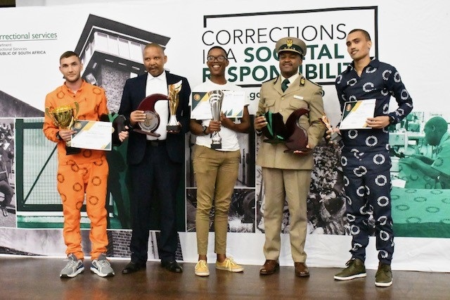 Deputy minister of Correctional Services, Nkosi Phathekile Holomisa, second-best student Devon Cameron Jacobs, and third-best student Nthuthuko Mshibe during the awards ceremony in Durban Westville Correctional Centre. 