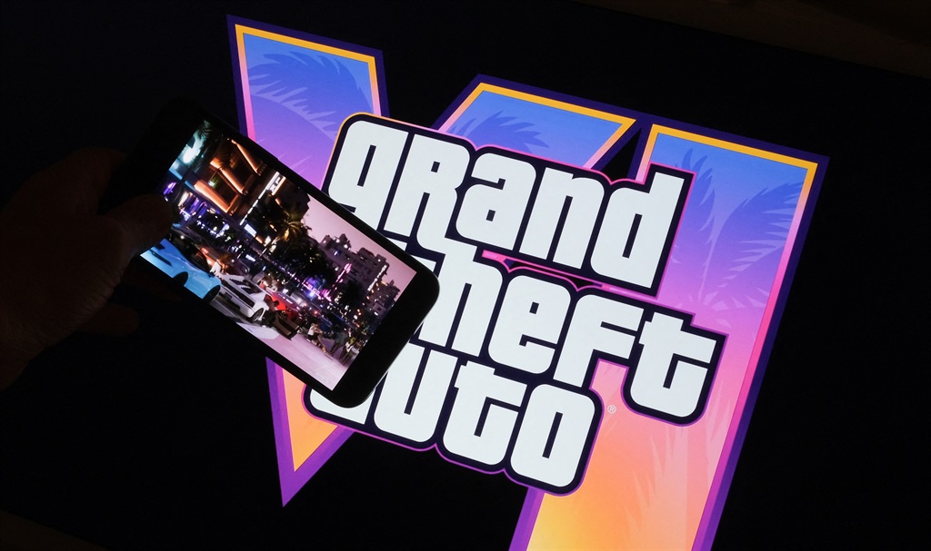 This illustration photo created in Los Angeles, December 4, 2023, shows Rockstar Games’ Grand Theft Auto VI trailer played on a screen in front of the game title.