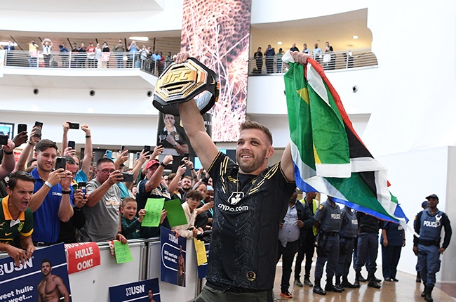 Dricus du Plessis acknowledges a large crowd at OR Tambo International airport on Thursday. (Photo by Lefty Shivambu/Gallo Images)