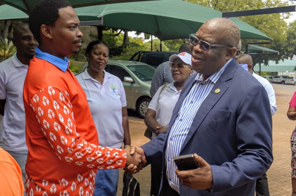 Xiluva leader Bongani Baloyi and SIU spokesman Kaizer Kganyago at the SIU offices in Tshwane on Thursday. Photo by Raymond Morare 