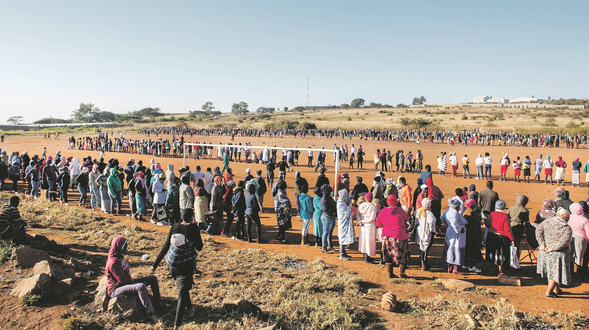 The rich have survival tools for the foreseeable future, but the less fortunate have only the government and NGOs on which to rely for basic things, such as food, as seen by this queue of people in a community in Tshwane, waiting for food parcels. Picture: gallo images / alet pretorius