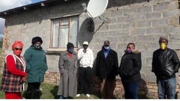 Amahlathi Mayor Agnes Hobo (second from left) and ward councillors visited the home of the 10th victim of the deadly booze at Mlungisi in Mzamo Village, Stutterheim, yesterday. 