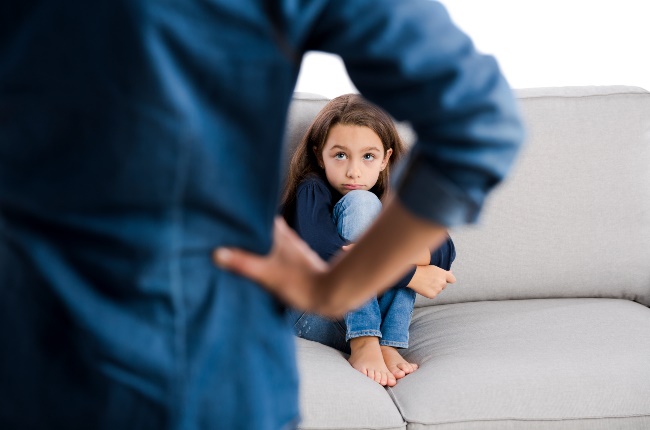 Grown up rebuking a little child for bad behavior. (PHOTO: Erik Reis for Getty Images)