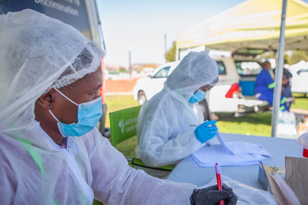 Health workers at a screening and testing site