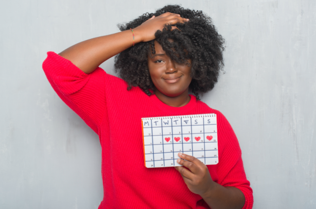 Young woman holding menstruation calendar (PHOTO: Getty Images)