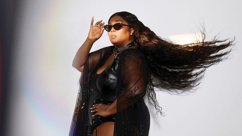 Lizzo poses with one of her sunglasses from her collaboration with Quay. Photo: Lizzo/Instagram