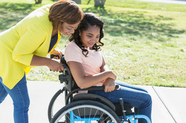 Mother with disabled child (PHOTO: Getty Images)
