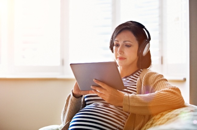 Woman listening to a podcast. (Photo: Getty Images)
