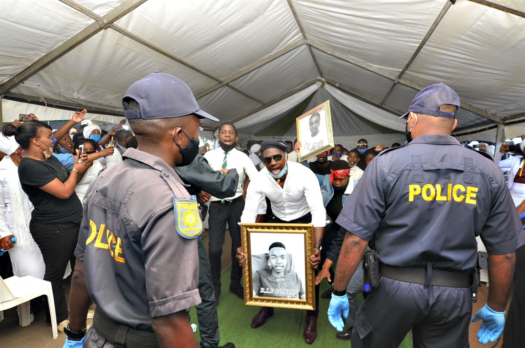 Caption: Police warning residents who was causing chaos with bikers during Bobo Mbuthu’s funeral at Hambanathi in Tongaat, north of Durban. Photo by Jabulani Langa 