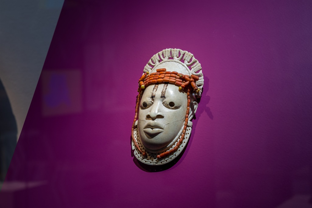 A 19th-century ivory, ceremonial hip mask in honour of Queen Mother Idia and looted by British soldiers from the Kingdom of Benin in 1897 hangs on display in the "Where Is Africa" exhibition at the Linden Museum on May 05, 2021 in Stuttgart, Germany. (Photo by Thomas Niedermueller/Getty Images)
