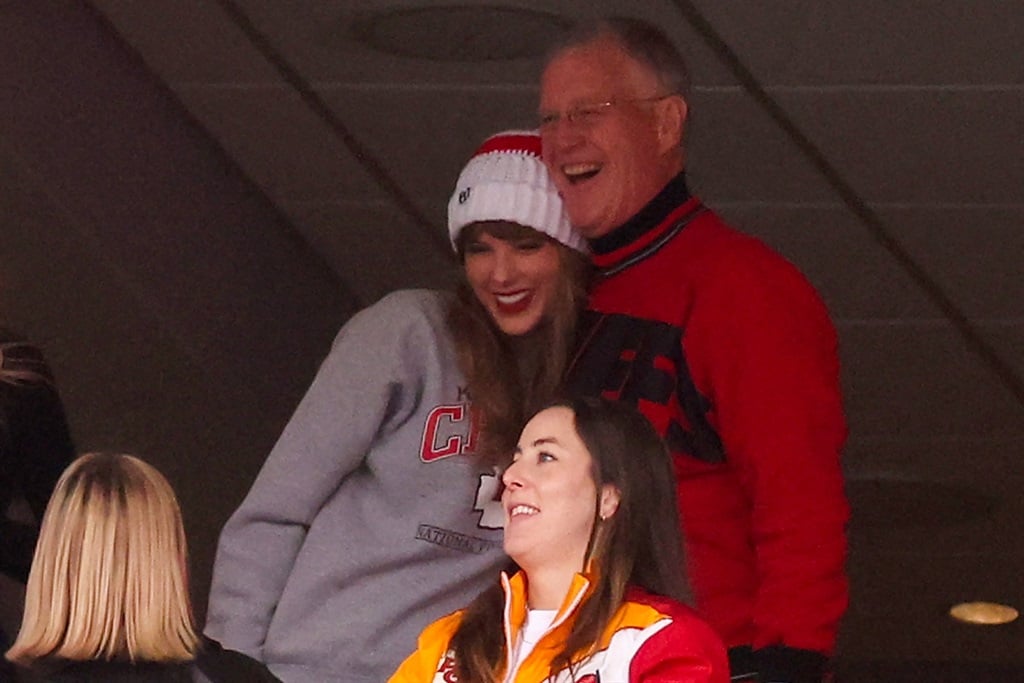 US singer Taylor Swift and her father Scott Kingsley Swift cheer as they watch the Kansas City Chiefs play the New England Patriots at Gillette Stadium in Foxborough, Massachusetts, on 17 December 2023. 