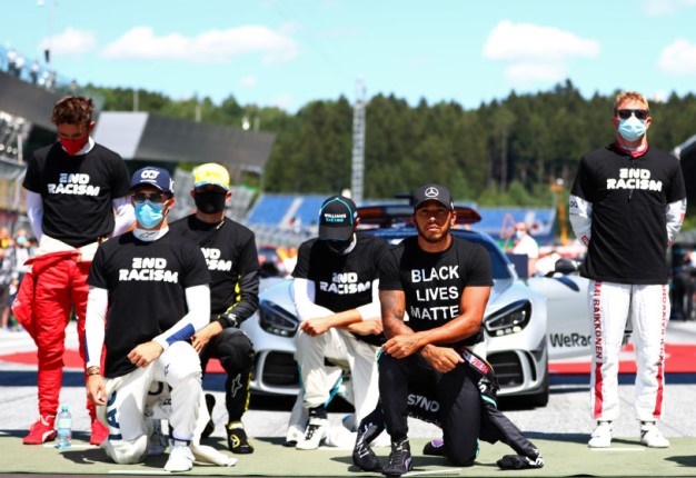 Lewis Hamilton, Pierre Gasly and some of the F1 drivers take a knee on the grid in support of the Black Lives Matter movement. (Photo by Dan Istitene - Formula 1/Formula 1 via Getty Images)