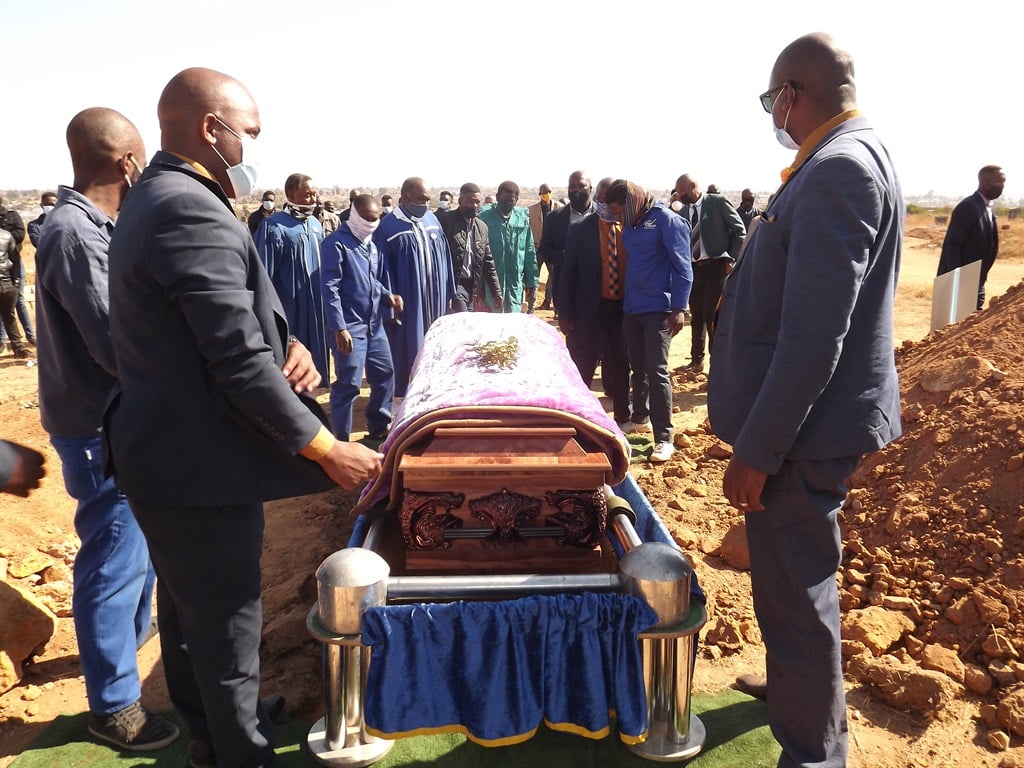 Putco bus crash victim Linah Madonsela’s coffin is lowered into the grave at the local cemetery in Tweefontein. (Balise Mabona)