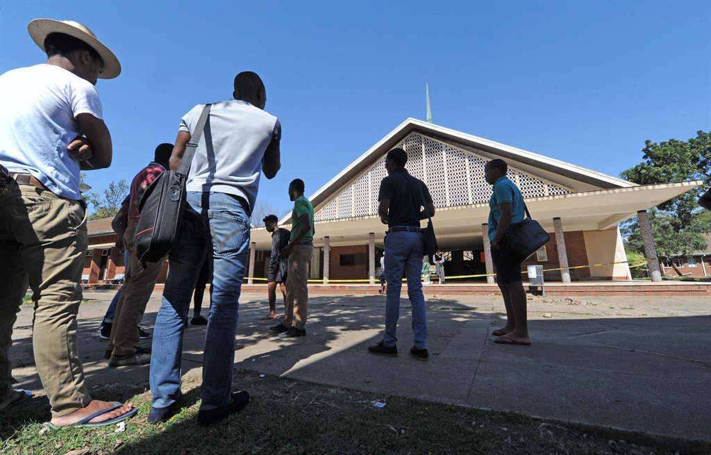 Students look on at the Pietermaritzburg William OBrien exam hall at the University of KwaZulu-Natal that was set alight in the early hours of yesterday morning.Photo.Ian CarbuttPhoto.Ian Carbutt