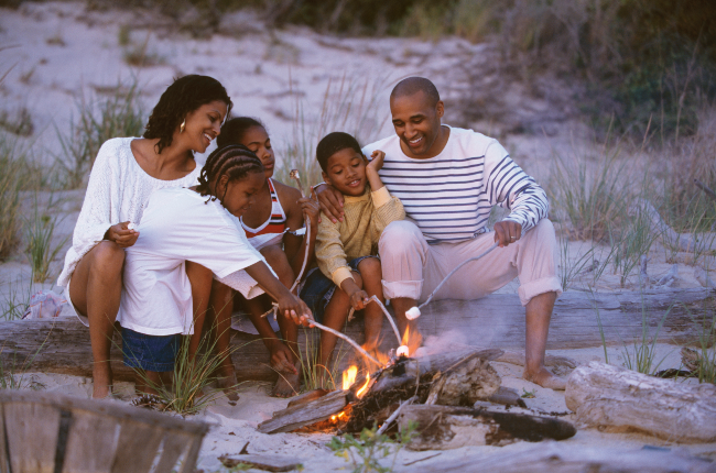 Family bonding around a fire