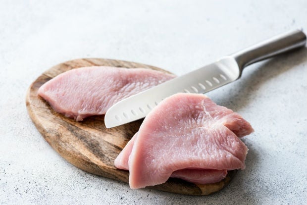 raw chicken on a chopping board