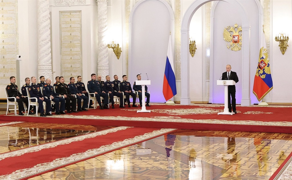 Vladimir Putin delivering a speech during a ceremony to present Gold Star medals to Heroes of Russia on 8 December 2023. (Photo by Valery SHARIFULIN / POOL / AFP)