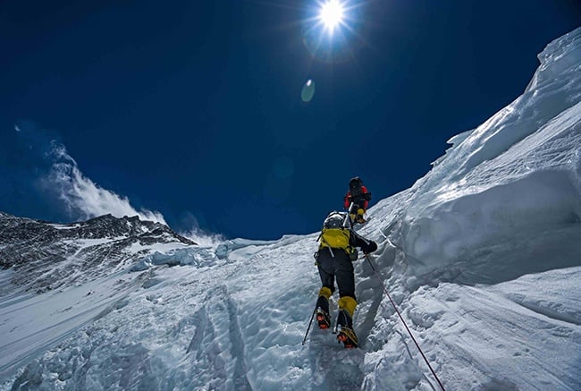 Team members climb Mt. Everest during an expeditio