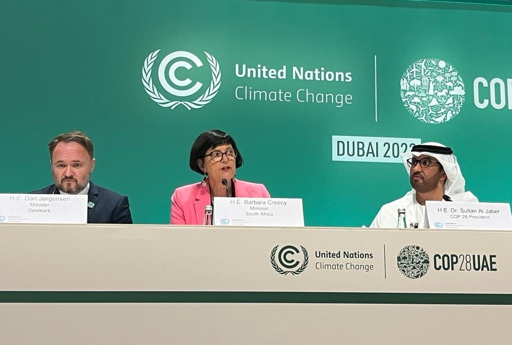 Denmark's Minister Dan Jørgensen (left), South Africa's Minister Barbara Creecy (middle) and COP28 president Dr Sultan Al Jaber address the press ahead of political negotiations.