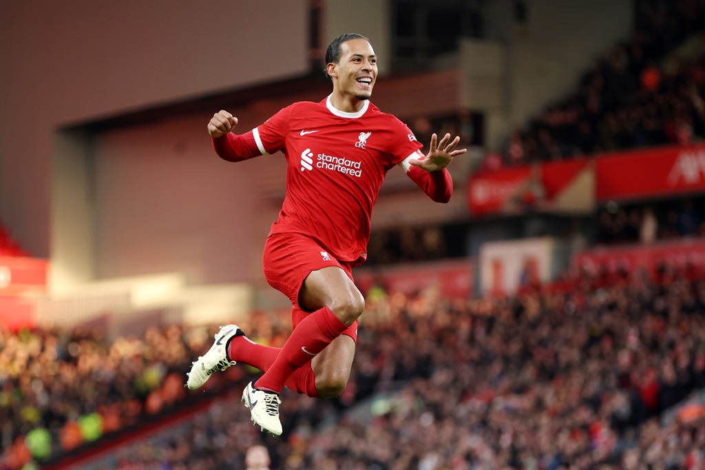 LIVERPOOL, ENGLAND - JANUARY 28: Virgil van Dijk of Liverpool celebrates scoring his teams fourth goal during the Emirates FA Cup Fourth Round match between Liverpool and Norwich City at Anfield on January 28, 2024 in Liverpool, England. (Photo by Clive Brunskill/Getty Images)