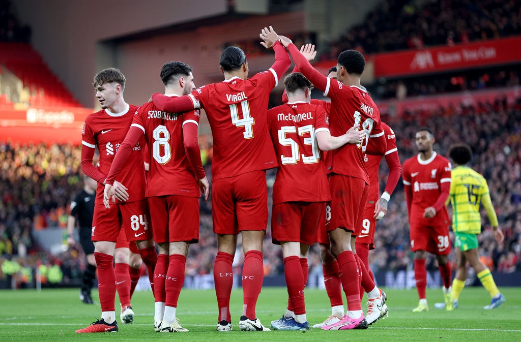 LIVERPOOL, ENGLAND - JANUARY 28: Virgil van Dijk of Liverpool celebrates with teammates after scoring his teams fourth goal during the Emirates FA Cup Fourth Round match between Liverpool and Norwich City at Anfield on January 28, 2024 in Liverpool, England. (Photo by Clive Brunskill/Getty Images)