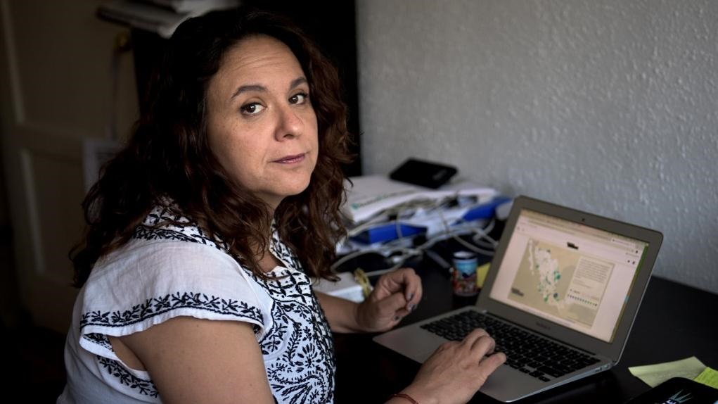 Mexican journalist Marcela Turati is pictured working on her desk in Mexico City, on April 30, 2019.
