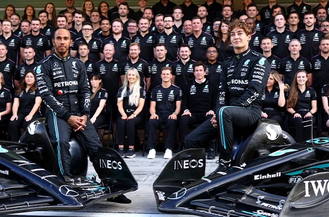 Lewis Hamilton (left) and George Russell with the Mercedes F1 team at the final race of the 2023 season in Abu Dhabi. (Clive Rose / Getty Images)