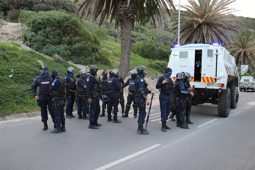 Law enforcement officers in Hangberg. (Roderick Damons)