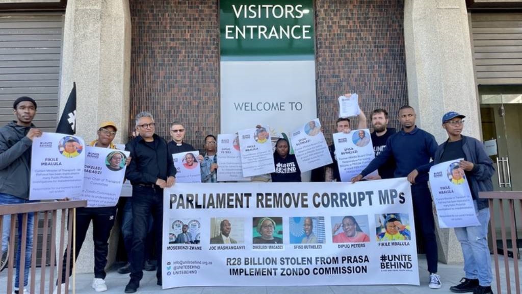 Members and supporters of #UniteBehind outside Parliament in August 2022 when they laid an official complaint to the Joint Committee on Ethics and Members' Interests.