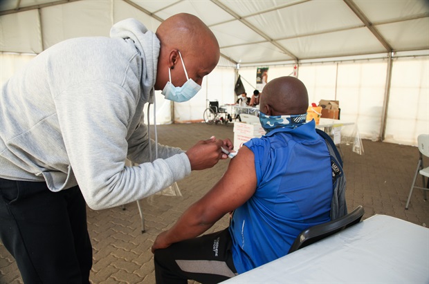 <p><strong>PIC: Getting jabbed in Zandspruit&nbsp;</strong></p><p>A person receives their Covid-19 jab at Zandspruit vaccination site in Johannesburg. (Photo by Gallo Images/Luba Lesolle)</p>