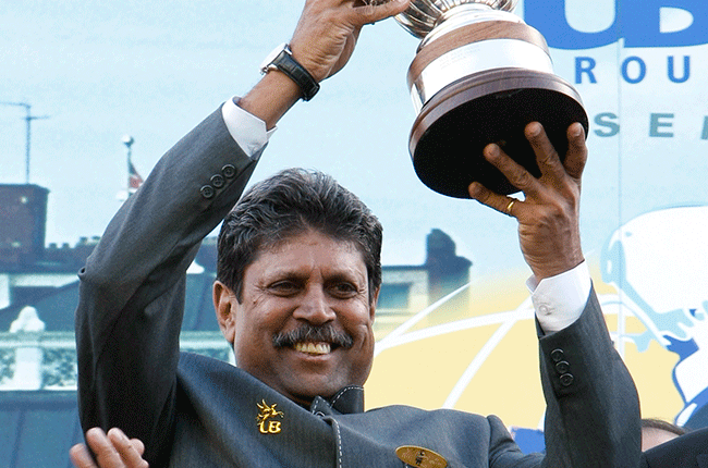 Kapil Dev, captain of the 1983 World Cup winning Indian cricket team holds up the actual cup won in 1983 at Lord's