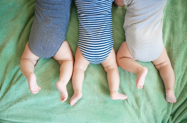 Newborn triplets lying down on a blanket. (PHOTO: Pirotehnik/Getty Images)