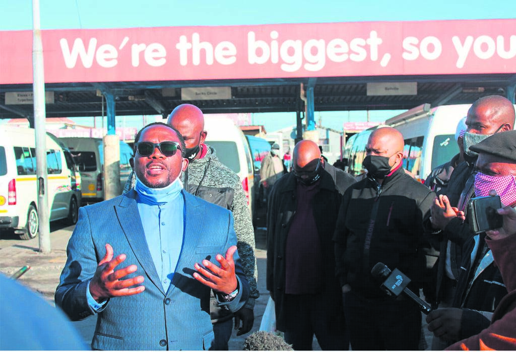 Bonginkosi Madikizela, MEC of transport and public works in the Western Cape chats to commuters at Site C taxi rank. 