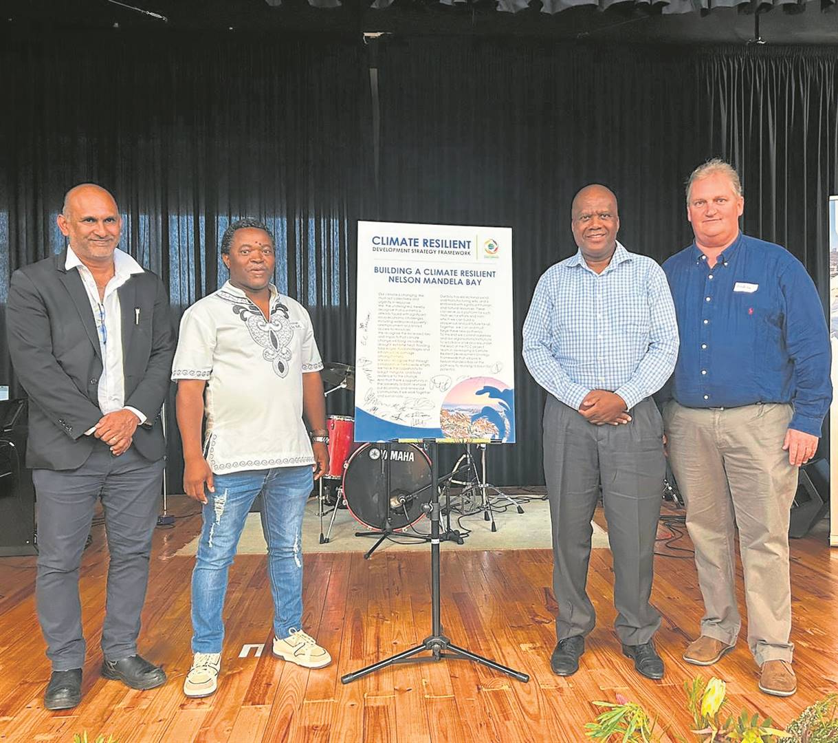 From left are Kelvin Naidoo (Chamber deputy president), Monga Peter (NMB Civil Society Coalition chairperson), Loyiso Dotwana (Chamber president) and Dr Andrew Muir (Chamber’s Immediate past president), during the signing of the pledge to build a Climate Resilient City at the Mendi Arts Centre in New Brighton.                          