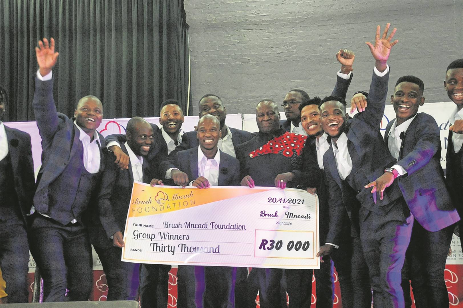 Isibusiso Musical Group with Brush Mncadi (middle) after tying with Umlazi South Gospel Group in first position at Saturday’s competition.       Photo by Jabulani Langa