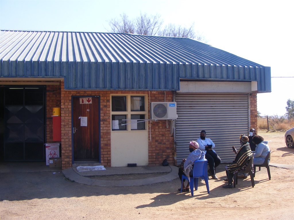 Bereaved family members wait for the bodies of their loved ones at the KwaMhlanga Hospital’s mortuary in Mpumalanga. (Balise Mabona, News24)