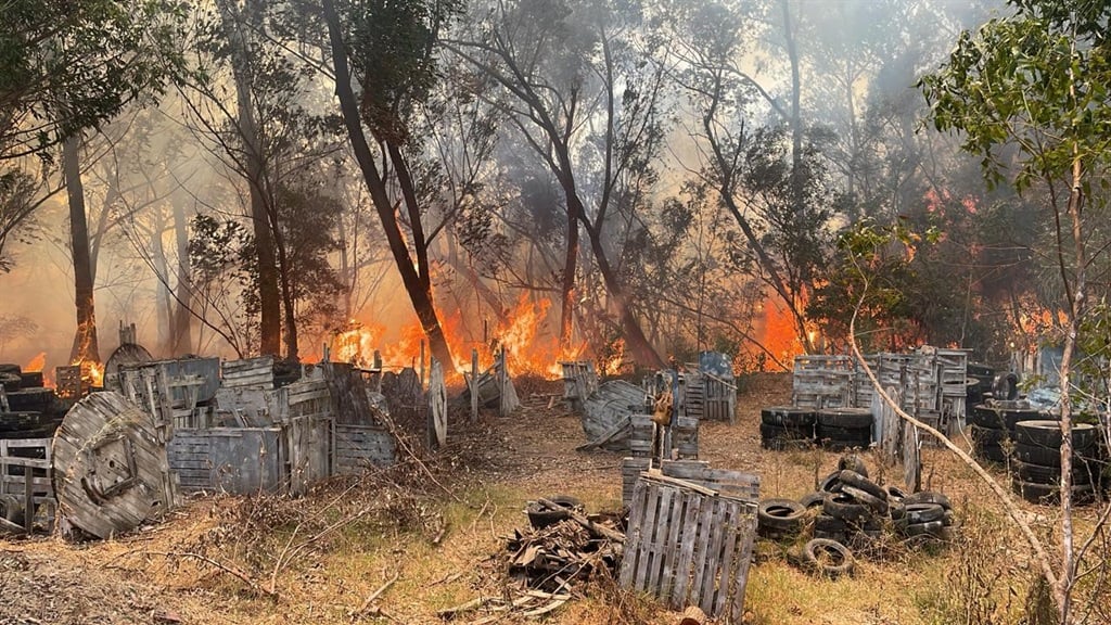 Flames fanned by the wind were raging through vegetation and tyres on the paintball range, which was severely affected.
