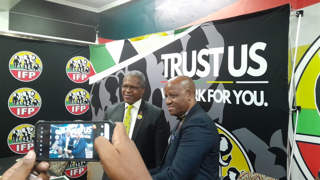 IFP president Velenkosini Hlabisa and the party's KZN premier candidate Thami Ntuli shake hands at a media briefing.