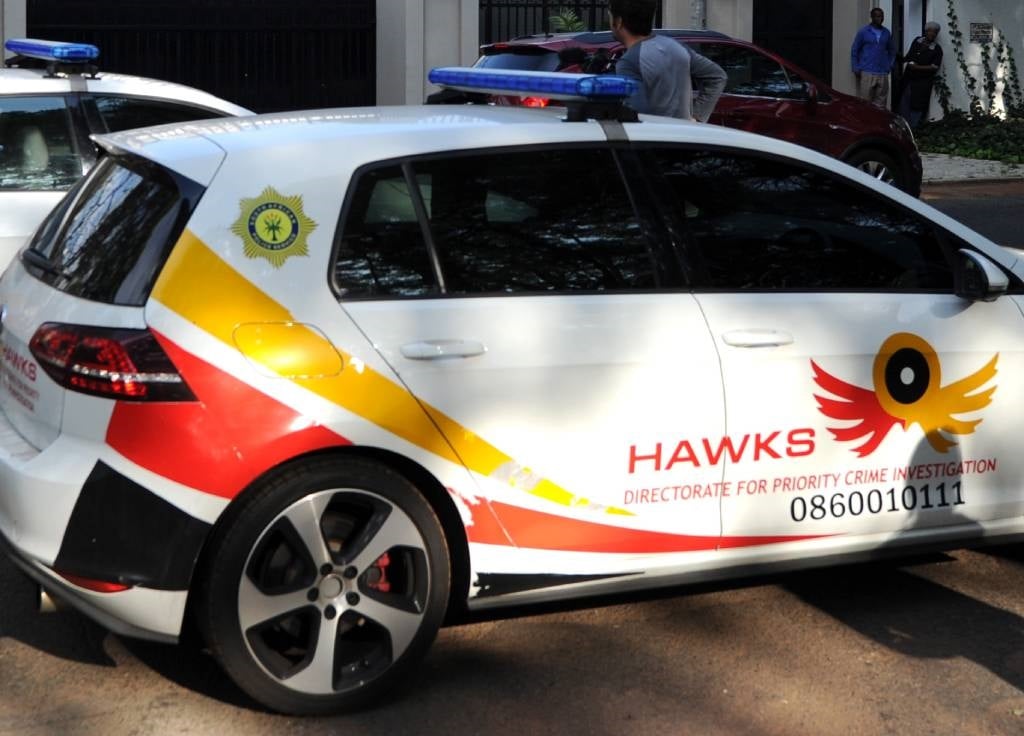 The Hawks have three people for alleged fraud and money laundering.
