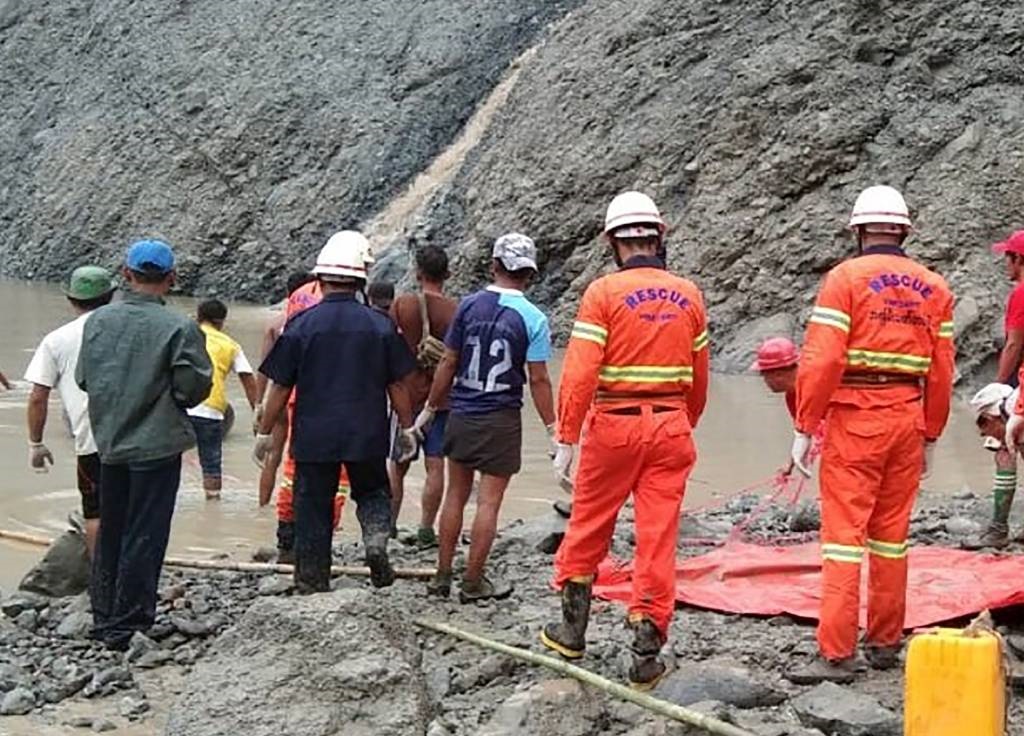 This handout from the Myanmar Fire Services Department shows rescuers attempting to locate survivors after a landslide at a jade mine in Hpakant, Kachin state. (Handout,  Myanmar Fire Services Department, AFP)