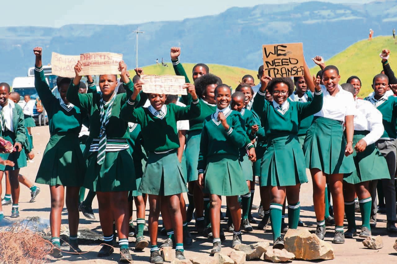 Jumba High School learners and their parents protest on the R412 between Ugie and Mthatha against cutting the number of buses ferrying them to school under the scholar transport programme.                                           
