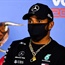 Hamilton on top with new black helmet as F1 roars back