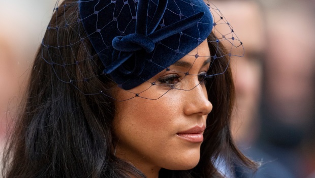 Meghan Markle performing one of her last royal duties. Photo by Mark Cuthbert/UK Press via Getty Images