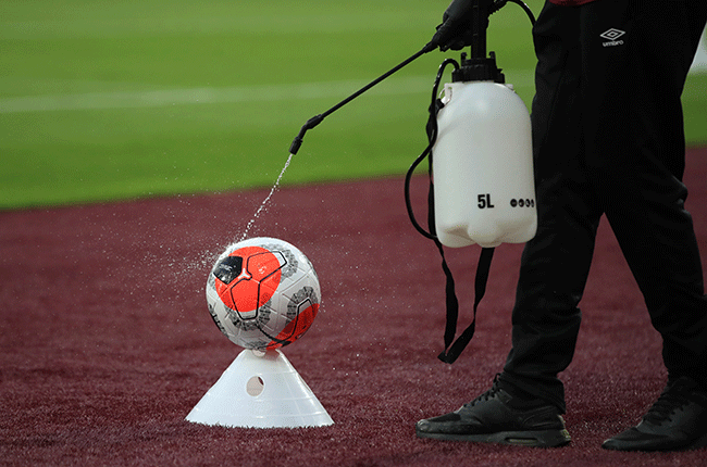 A soccer ball is disinfected