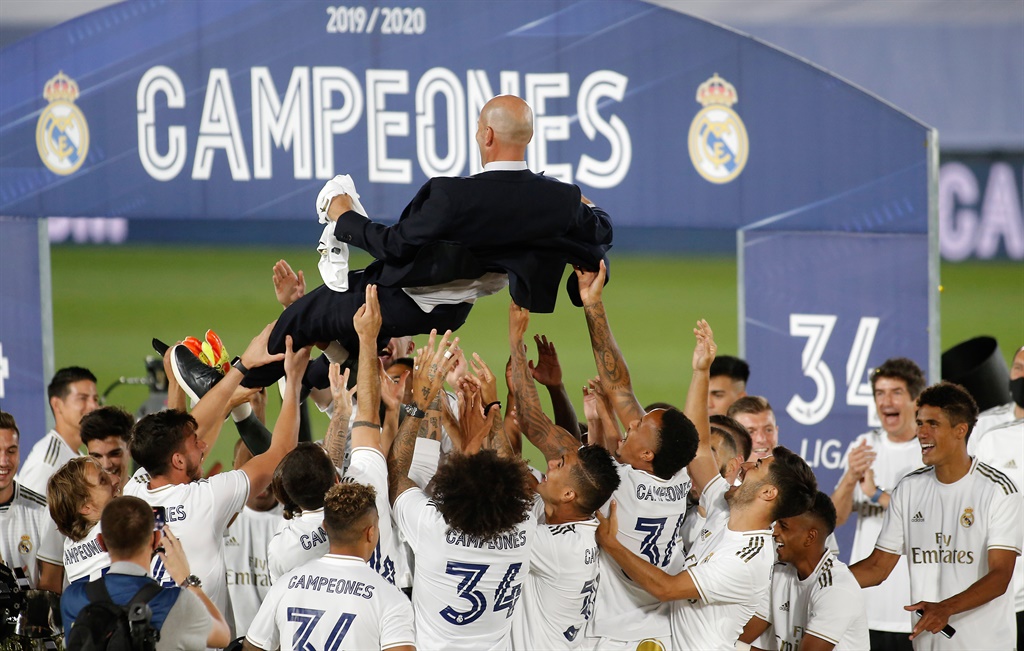 Real Madrid players throw coach Zinedine Zidane up in the air after winning the Liga match between Real Madrid CF and Villarreal. Picture: Baldesca/DeFodi Images via Getty Images