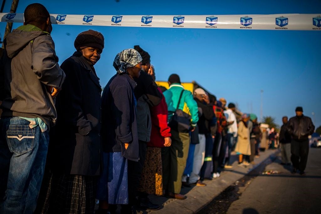 People wait in line to cast their vote in Alexandra during the 2016 Local Government Elections. (Cornel van Heerden/Foto24/Gallo Images/Getty Images)