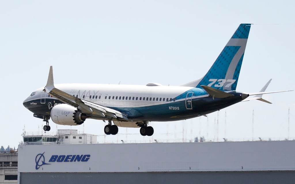 A Boeing 737 MAX jet lands following a Federal Aviation Administration test flight at Boeing Field in Seattle, Washington on June 29, 2020. 