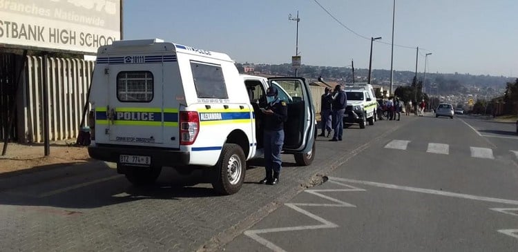 Police stood outside East Bank Secondary School as members of the Congress of South African Students called for all schools to close.